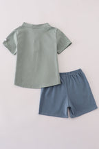 Green character applique shorts set