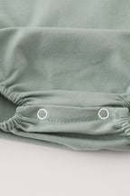 Green character applique bubble